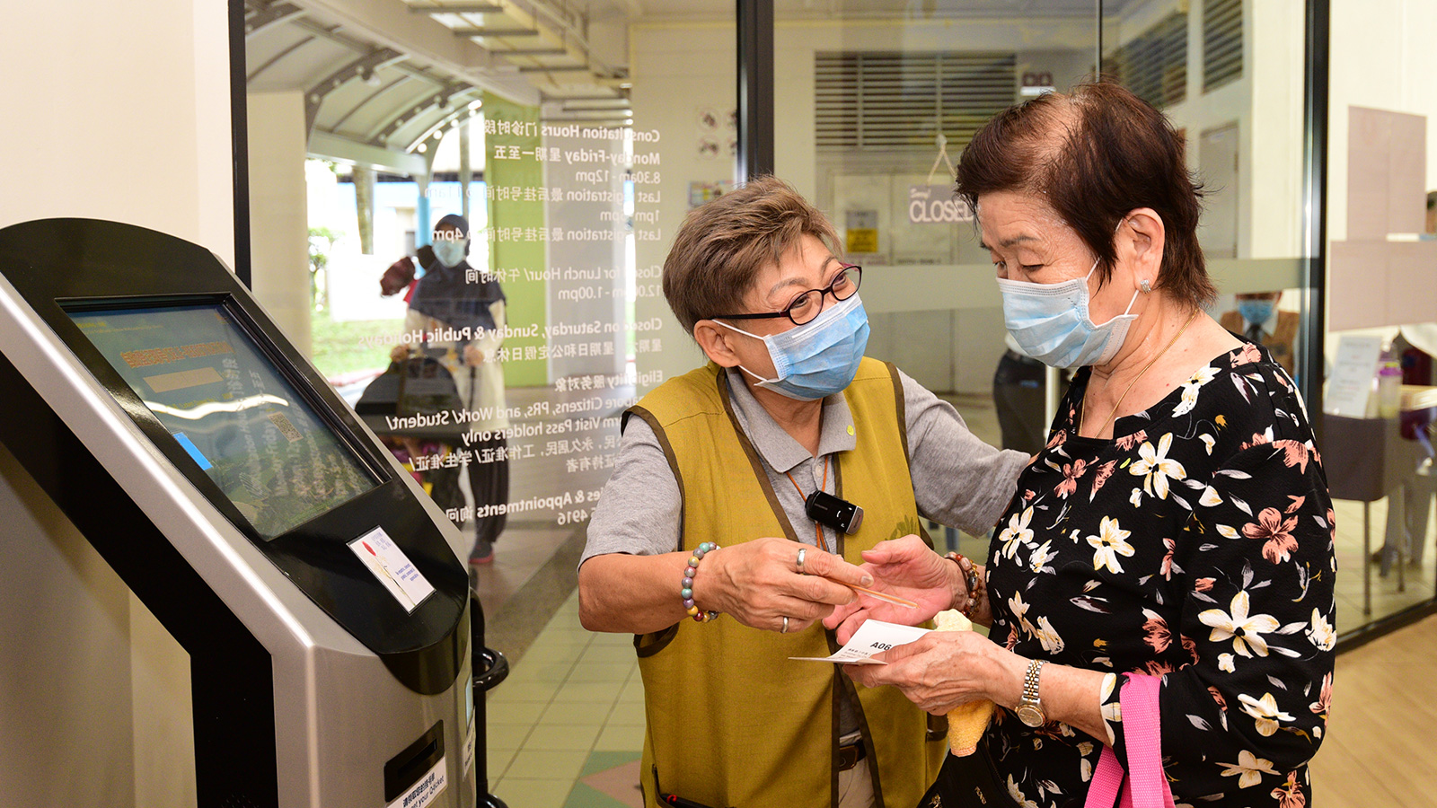 A face mask can never shield the joy of volunteers who happily serve at the Tzu Chi TCM free clinic in Khatib.