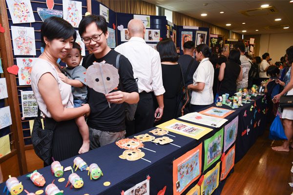 The artwork of the graduands, including self-portraits and especially the handicrafts made from recycled materials on display in the main hall attracted much interest. (Photo by Wong Twee Hee)